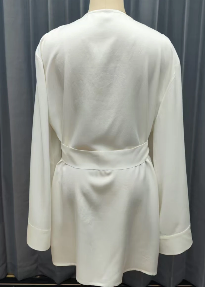 Close-up of silk loungewear fabric and stitching details