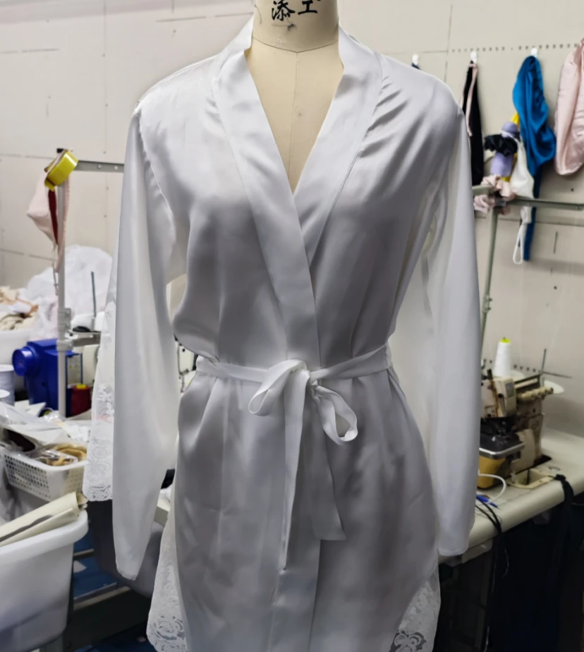 Custom white silk robe with belted waist on mannequin