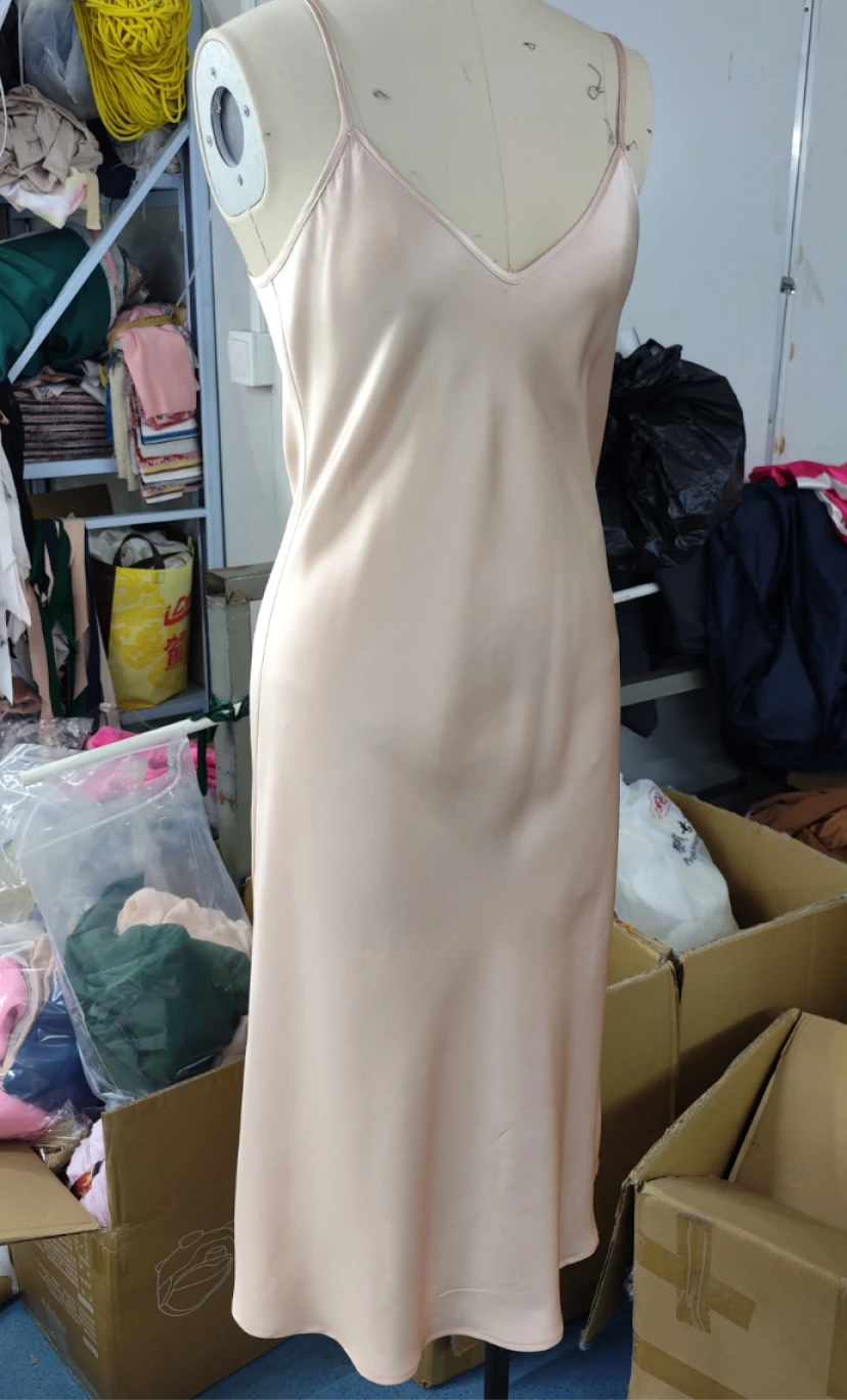 Back view of white silk robe with belted waist and long sleeves