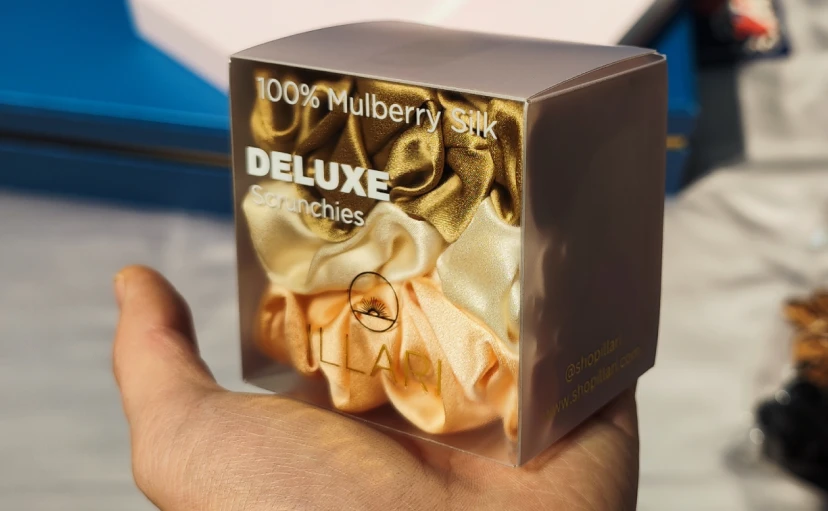 Clear PVC display box with DELUXE branding for premium silk hair accessories