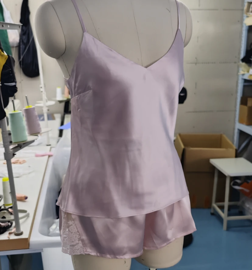 Pink silk camisole and shorts set with V-neck design