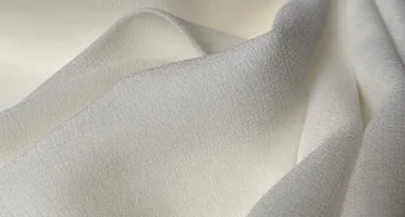 White stretch silk fabric detail with smooth drape