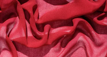 Red silk chiffon fabric showing color depth through sheerness