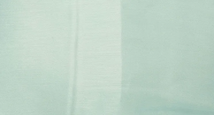 Light blue silk linen fabric with linen grain visible