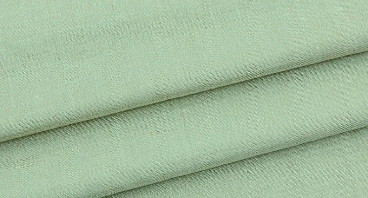 Green silk dupioni fabric swatch with emerald depth